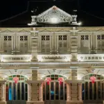 Illuminated Phuket Thai Hua Museum building in Phuket Old Town at night